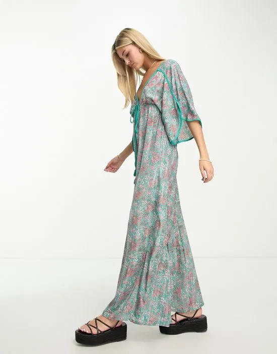 https://images.styletyx.com/images/kassie-plunge-front-printed-maxi-dress-in-teal-raga-13454973_3.webp