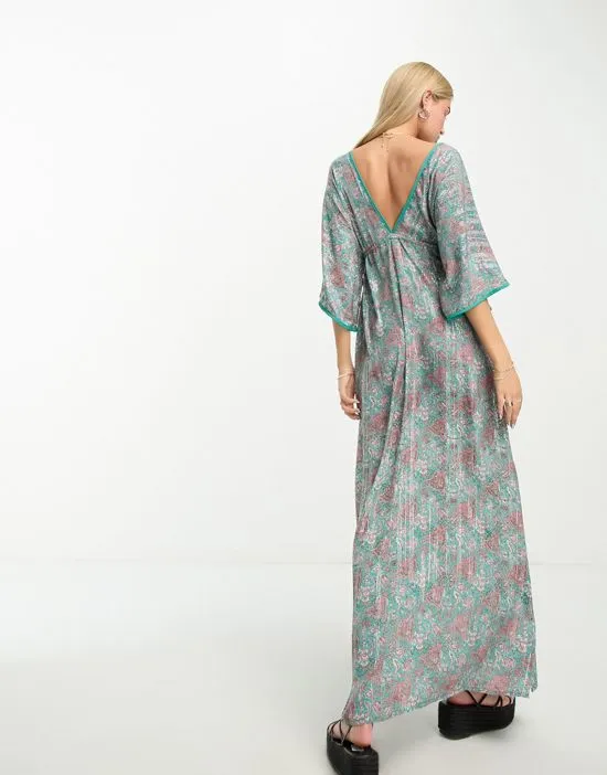 https://images.styletyx.com/images/kassie-plunge-front-printed-maxi-dress-in-teal-raga-13454973_4.webp