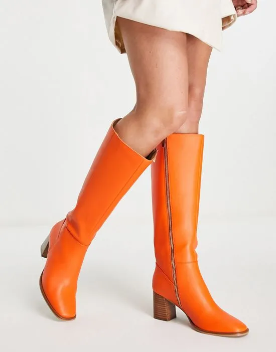https://images.styletyx.com/images/knee-high-leather-boots-in-orange-never-fully-dressed-1730608_1.webp