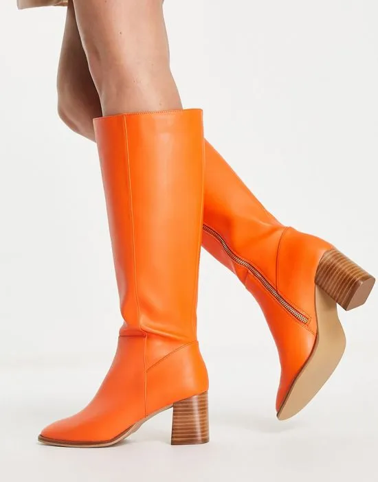 https://images.styletyx.com/images/knee-high-leather-boots-in-orange-never-fully-dressed-1730608_3.webp