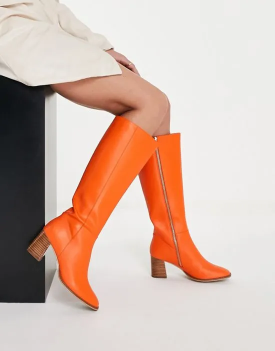 https://images.styletyx.com/images/knee-high-leather-boots-in-orange-never-fully-dressed-1730608_4.webp