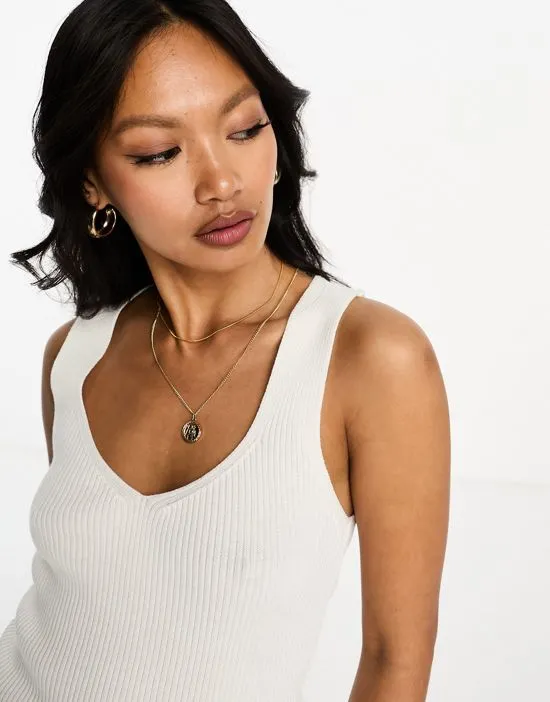 https://images.styletyx.com/images/knit-v-neck-tank-top-in-cream-asos-design-13237858_2.webp