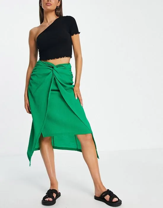 https://images.styletyx.com/images/knot-front-midi-skirt-in-green-stradivarius-2018925_1.webp