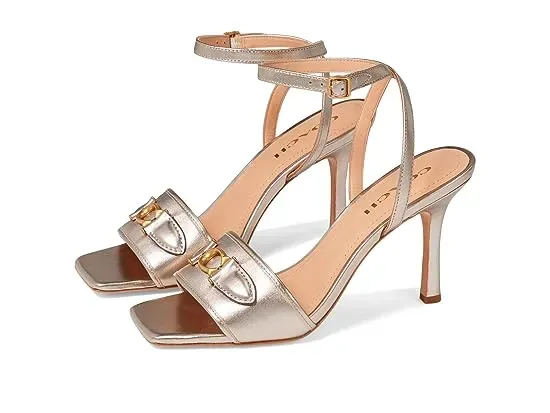 https://images.styletyx.com/images/kyra-metallic-leather-sandal-coach-776511375_1.webp