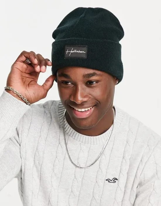 https://images.styletyx.com/images/label-logo-rib-knit-beanie-in-black-hollister-13647249_1.webp