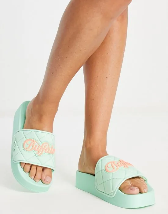 https://images.styletyx.com/images/lake-soft-quilted-sliders-in-aqua-buffalo-2772826_1.webp