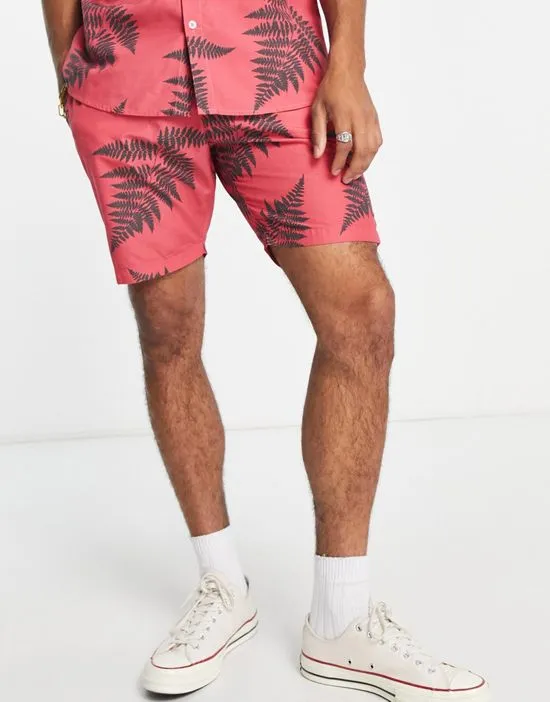 https://images.styletyx.com/images/leaf-print-shorts-in-coral-part-of-a-set-le-breve-1898459_1.webp