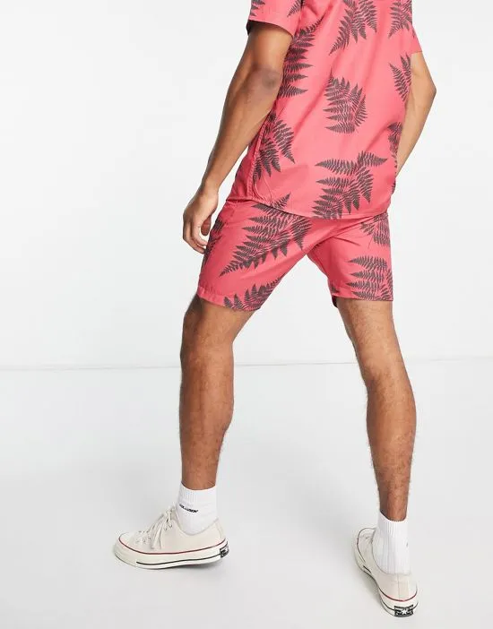 https://images.styletyx.com/images/leaf-print-shorts-in-coral-part-of-a-set-le-breve-1898459_2.webp