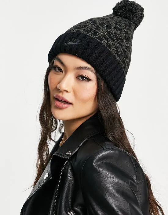 https://images.styletyx.com/images/leopard-print-pom-pom-cuffed-beanie-in-black-nike-2767467_2.webp