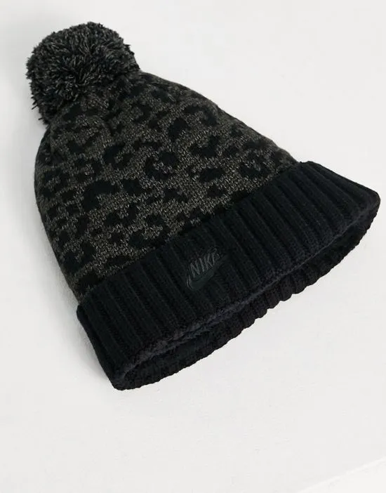 https://images.styletyx.com/images/leopard-print-pom-pom-cuffed-beanie-in-black-nike-2767467_3.webp