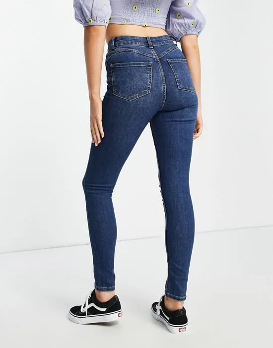 https://images.styletyx.com/images/lift-shape-skinny-jeans-in-mid-blue-new-look-1782918_2.webp