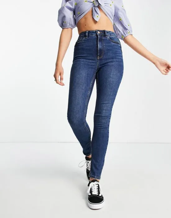 https://images.styletyx.com/images/lift-shape-skinny-jeans-in-mid-blue-new-look-1782918_4.webp