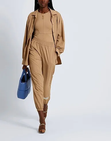 https://images.styletyx.com/images/light-brown-synthetic-fabric-top-the-giving-movement-x-yoox-235987_4.webp