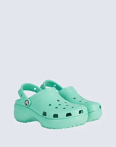 https://images.styletyx.com/images/light-green-mules-and-clogs-crocs-13250707_4.webp