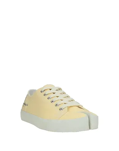 https://images.styletyx.com/images/light-yellow-canvas-sneakers-maison-margiela-13338349_2.webp