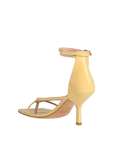 https://images.styletyx.com/images/light-yellow-leather-flip-flops-lella-baldi-13294105_3.webp