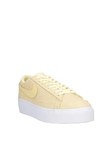 https://images.styletyx.com/images/light-yellow-plain-weave-sneakers-nike-874027417_2.webp