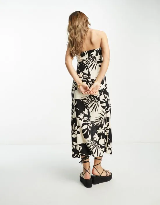 https://images.styletyx.com/images/linen-scoop-halter-maxi-sundress-with-knot-detail-in-tropical-mono-print-asos-design-13316877_2.webp