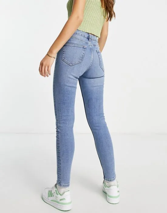 https://images.styletyx.com/images/lizzie-high-rise-ripped-hem-skinny-jeans-in-midwash-blue-miss-selfridge-3163328_2.webp