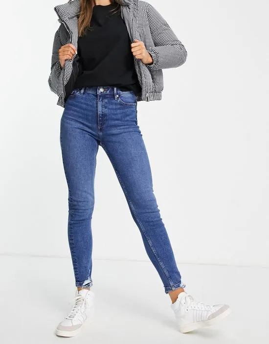 https://images.styletyx.com/images/lizzie-high-waist-authentic-skinny-jeans-in-midwash-blue-miss-selfridge-2752688_2.webp