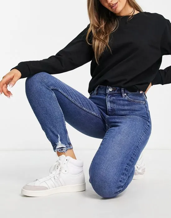 https://images.styletyx.com/images/lizzie-high-waist-authentic-skinny-jeans-in-midwash-blue-miss-selfridge-2752688_3.webp