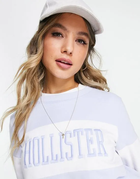 https://images.styletyx.com/images/logo-crew-neck-sweatshirt-in-blue-hollister-1788855_3.webp