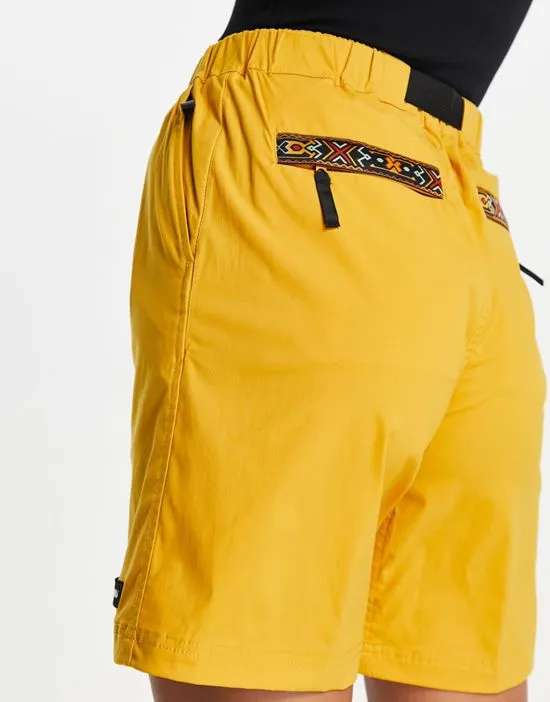 https://images.styletyx.com/images/logo-shorts-in-yellow-berghaus-2772142_2.webp
