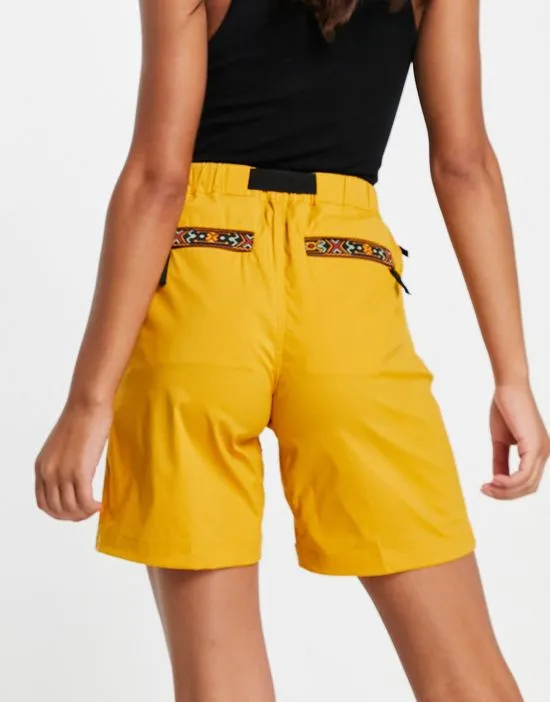 https://images.styletyx.com/images/logo-shorts-in-yellow-berghaus-2772142_4.webp
