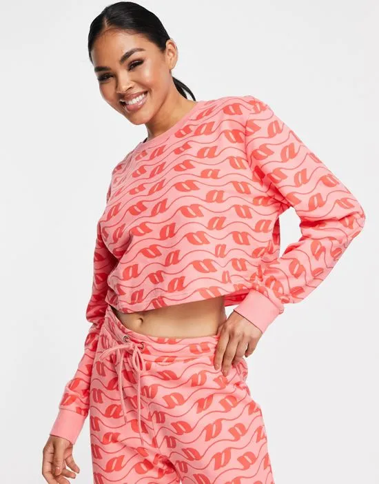 https://images.styletyx.com/images/lounge-monogram-print-sweatshirt-sweatpants-set-in-pink-red-asos-design-2568822_3.webp