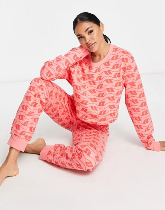 https://images.styletyx.com/images/lounge-monogram-print-sweatshirt-sweatpants-set-in-pink-red-asos-design-2568822_4.webp