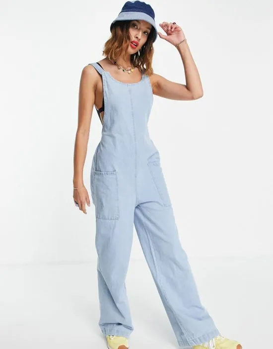 https://images.styletyx.com/images/low-back-denim-jumpsuit-in-light-blue-wash-noisy-may-13316725_1.webp
