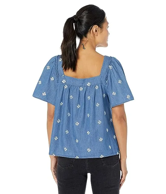 https://images.styletyx.com/images/maren-top-in-embroidered-chambray-draper-james-13056039_2.webp