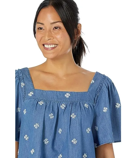 https://images.styletyx.com/images/maren-top-in-embroidered-chambray-draper-james-13056039_3.webp