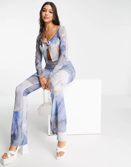 https://images.styletyx.com/images/mesh-tie-front-cardigan-in-blue-tie-dye-monki-2788045_4.webp