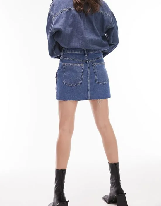 https://images.styletyx.com/images/mid-rise-cargo-denim-skirt-in-mid-blue-topshop-13008150_2.webp