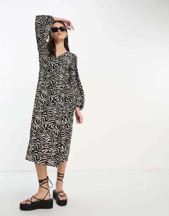 https://images.styletyx.com/images/midi-wrap-dress-in-black-and-white-print-object-13276148_4.webp