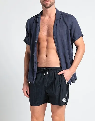 https://images.styletyx.com/images/midnight-blue-techno-fabric-swim-shorts-madd-13243942_2.webp