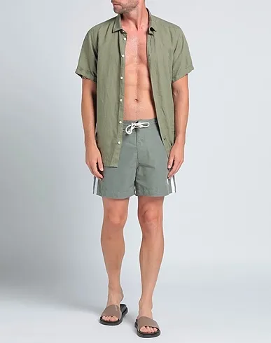 https://images.styletyx.com/images/military-green-techno-fabric-swim-shorts-palm-angels-1004130348_2.webp