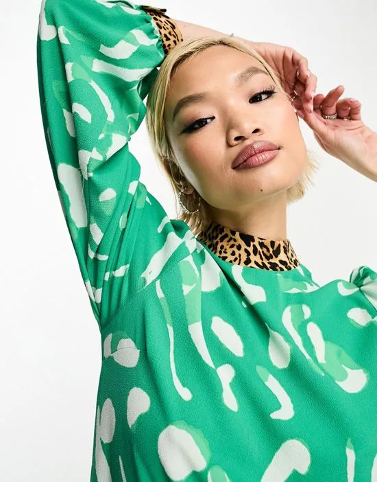 https://images.styletyx.com/images/mixed-print-high-neck-smock-maxi-dress-in-green-abstract-print-asos-design-3308446_2.webp