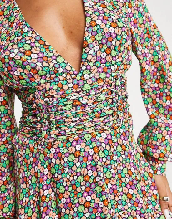 https://images.styletyx.com/images/nami-long-sleeve-corset-lace-up-floral-mini-dress-in-multi-afrm-12999156_3.webp