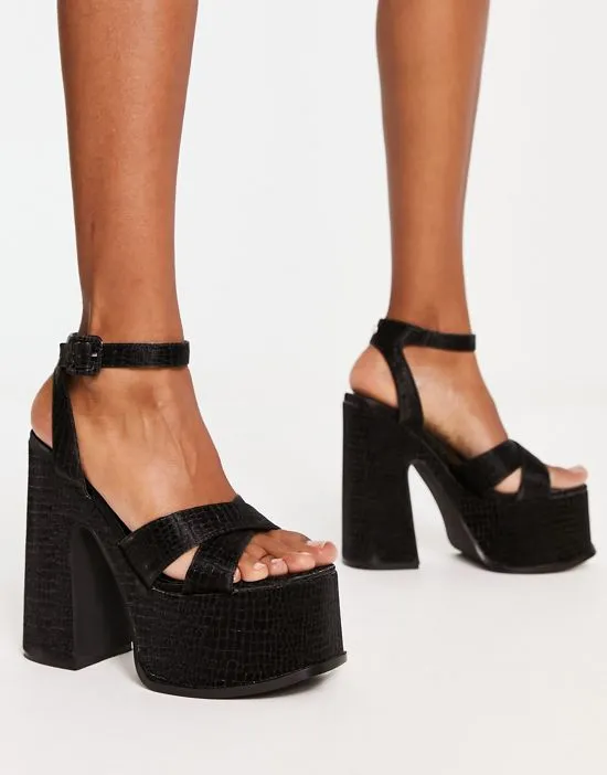 https://images.styletyx.com/images/natasha-platform-sandals-in-black-shellys-london-2604714_1.webp