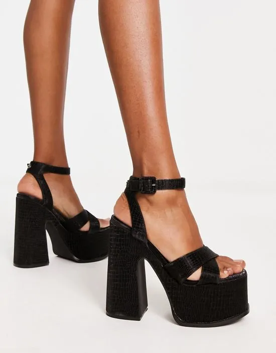 https://images.styletyx.com/images/natasha-platform-sandals-in-black-shellys-london-2604714_2.webp