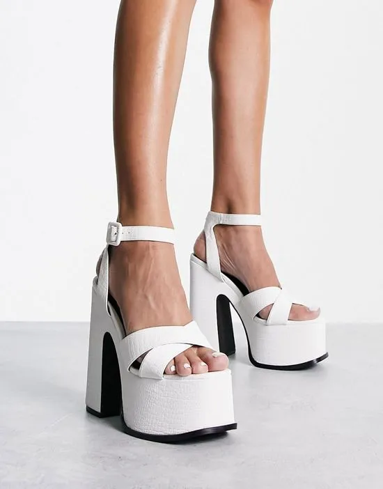 https://images.styletyx.com/images/natasha-platform-sandals-in-white-shellys-london-13001429_1.webp