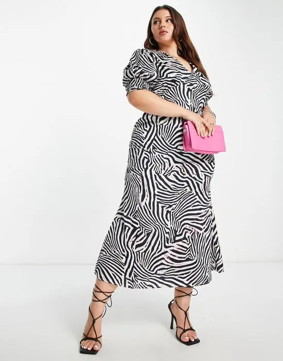 https://images.styletyx.com/images/never-fully-dressed-puff-sleeve-maxi-dress-in-zebra-print-never-fully-dressed-plus-13140121_4.webp