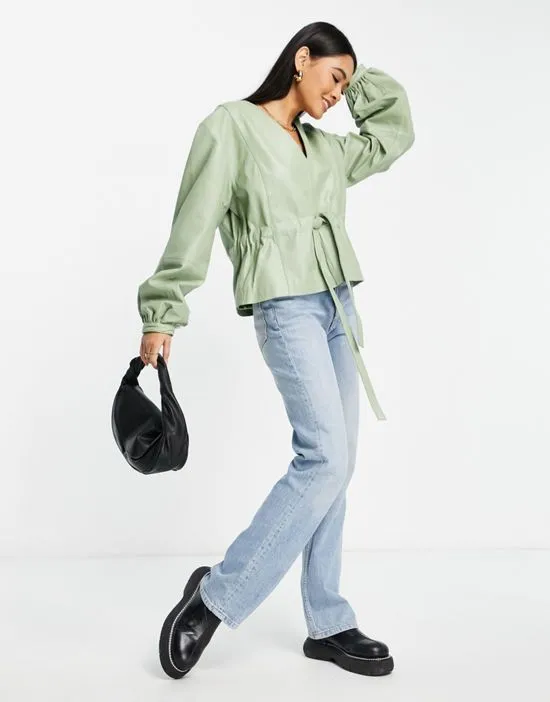 https://images.styletyx.com/images/nun-volume-sleeve-leather-top-in-sage-green-part-of-a-set-muubaa-2643007_4.webp
