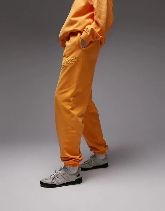 https://images.styletyx.com/images/nyc-project-puff-printed-vintage-wash-oversized-sweatpants-in-orange-part-of-a-set-topshop-601051569_3.webp