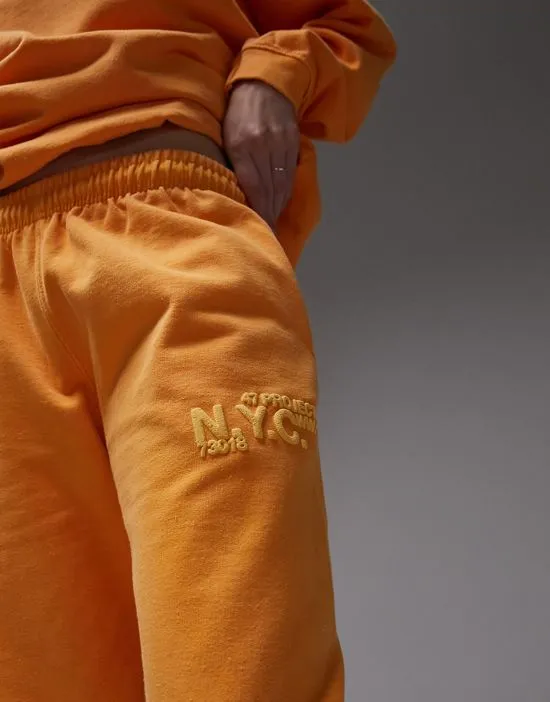 https://images.styletyx.com/images/nyc-project-puff-printed-vintage-wash-oversized-sweatpants-in-orange-part-of-a-set-topshop-601051569_4.webp