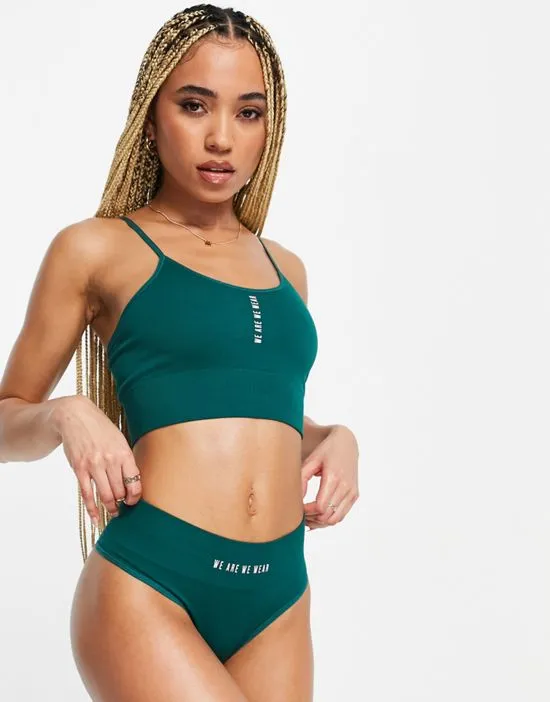 https://images.styletyx.com/images/nylon-blend-seamless-high-waist-thong-with-logo-detail-in-green-mgreen-we-are-we-wear-3014166_4.webp