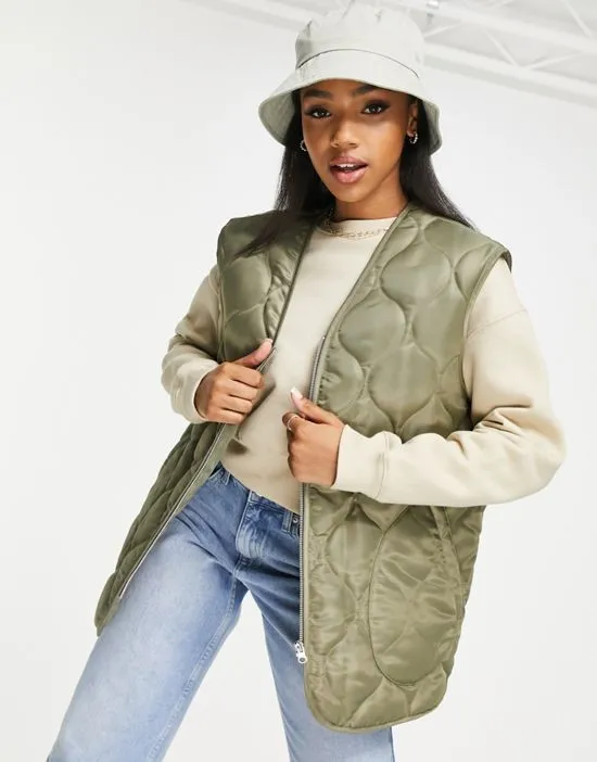 https://images.styletyx.com/images/nylon-onion-quilted-vest-in-light-khaki-asos-design-2341802_1.webp