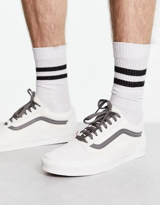 https://images.styletyx.com/images/old-skool-sneakers-in-off-white-with-gray-side-stripe-vans-13429415_4.webp